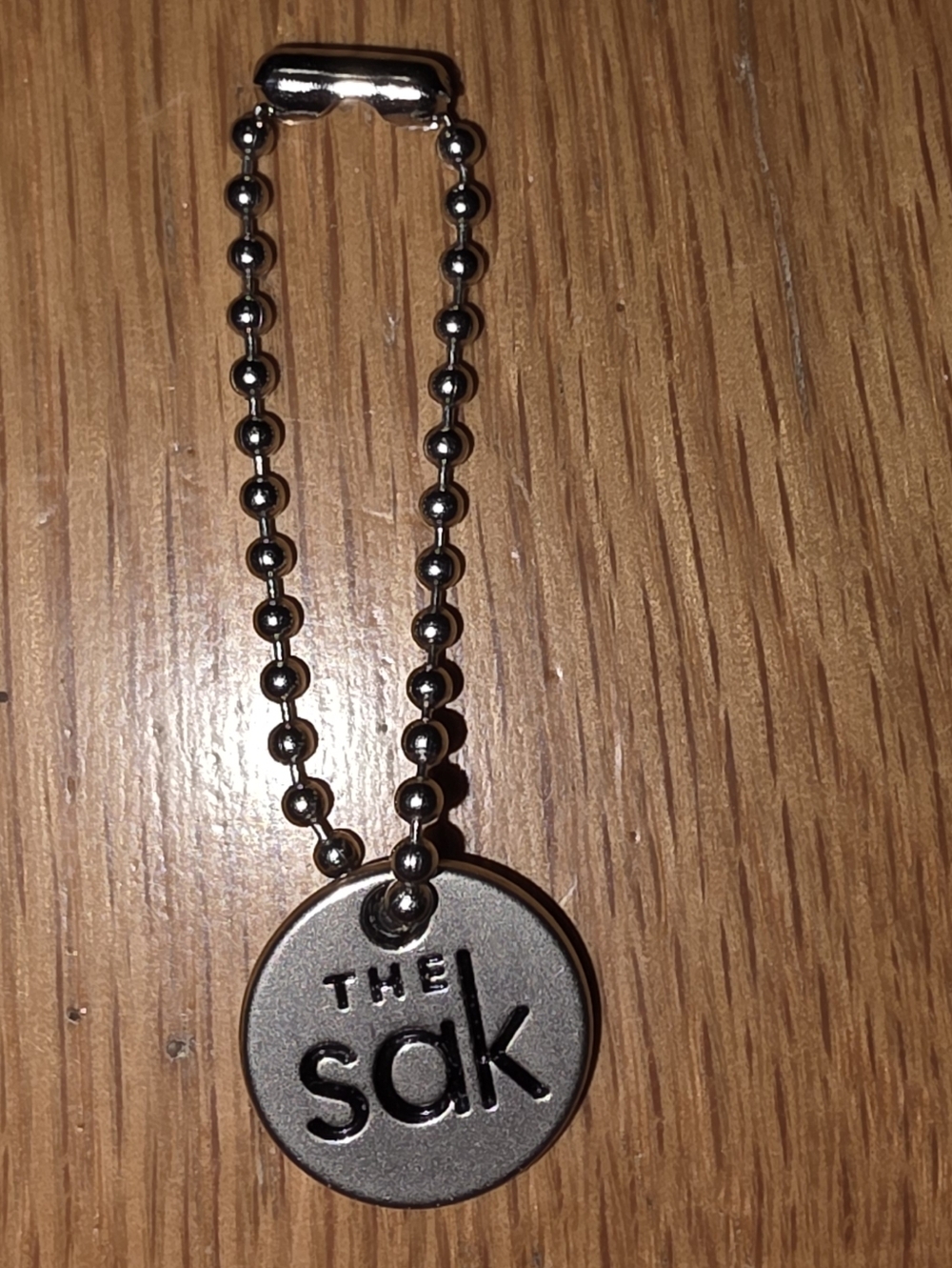 The Sak Silver Round Logo Keychain Hangtag A Purse Wallet Or Coin Replacement!